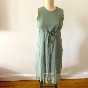 Morgane Le Fay sage colored knee length dress with silk overlay. Size small.